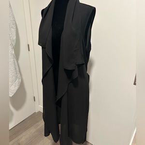 Nice throw over to dress up any outfit. Black size large from CLEO